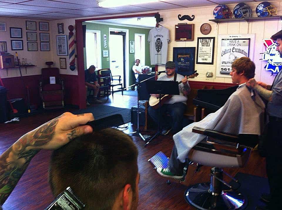 Archbald shop — barbers working while someone plays banjo